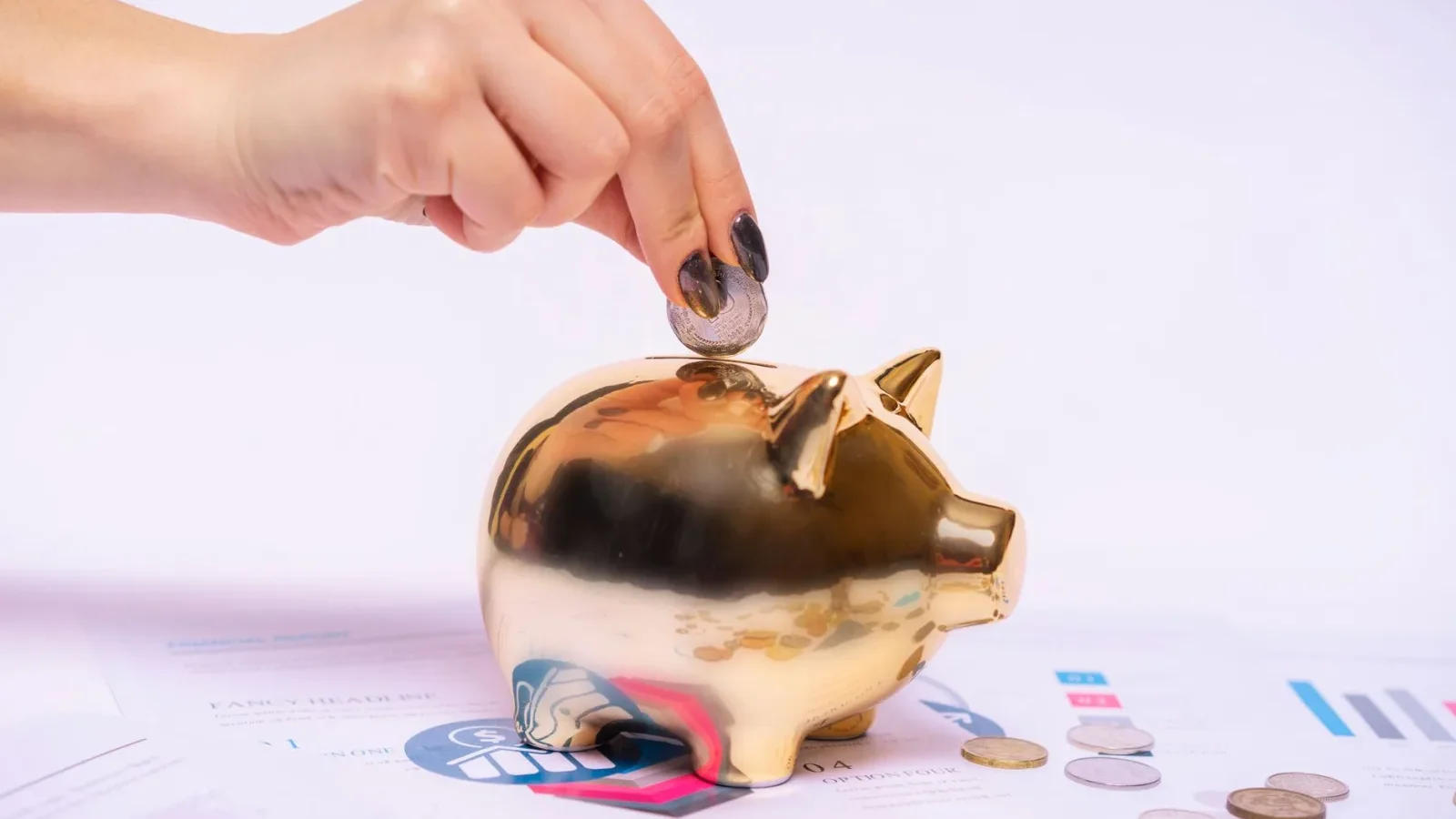 Piggy bank and coins representing a monthly savings plan for home maintenance