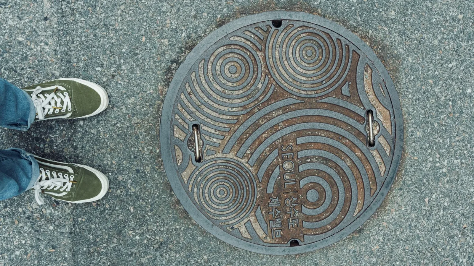 Open septic tank access lid showing the outlet side where an effluent filter sits