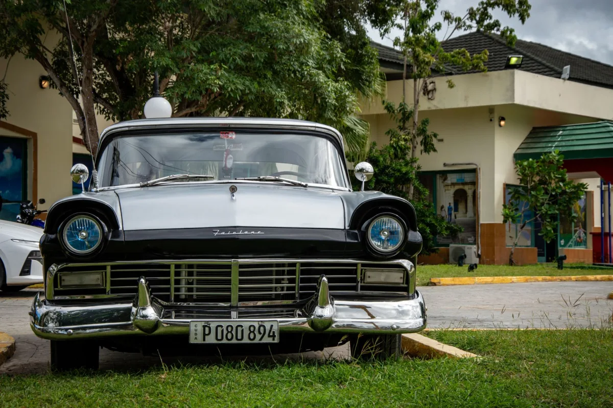 Vehicle parked on a grassy yard representing weight over a drain field