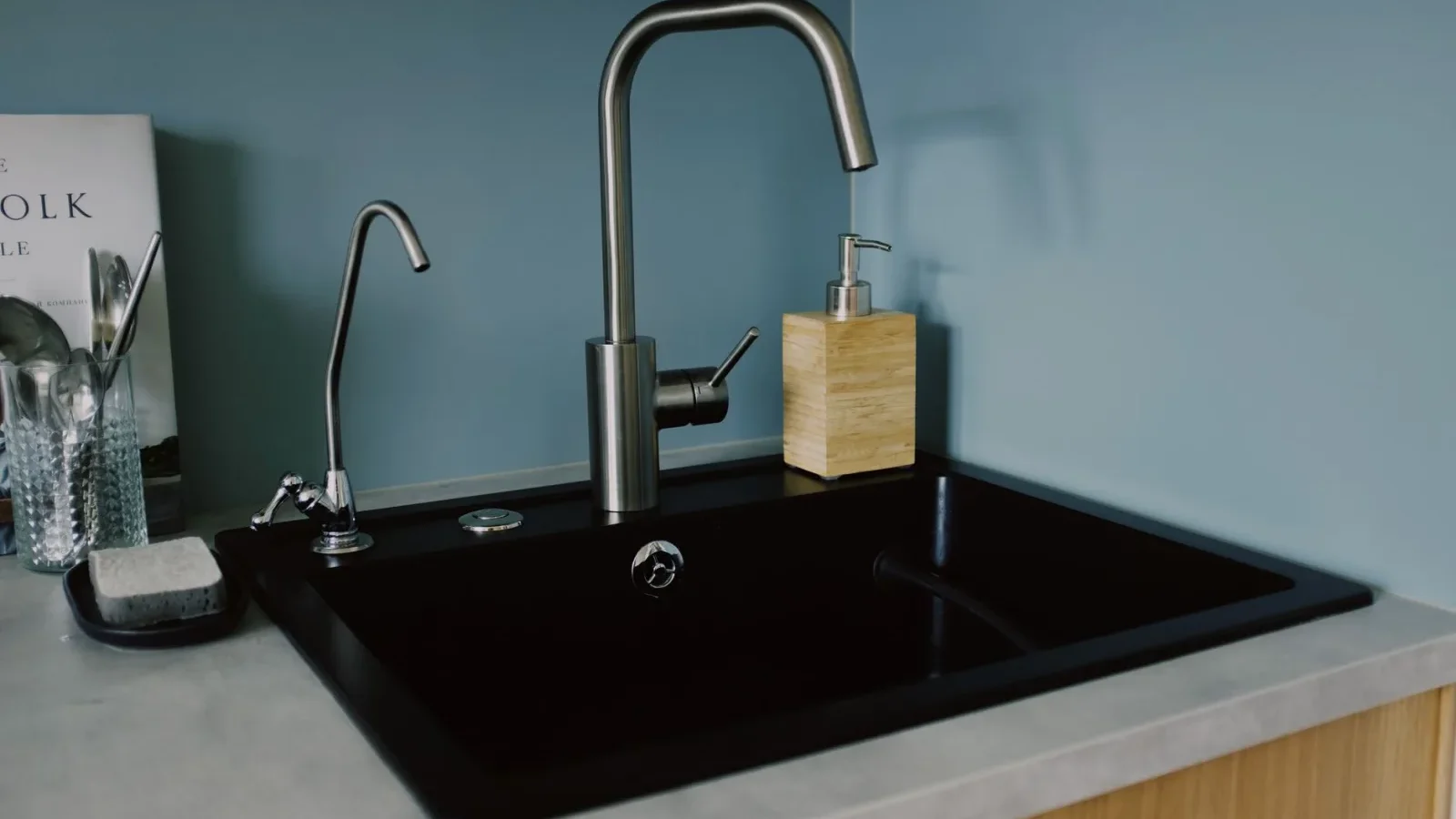 Water draining slowly and pooling in a kitchen sink in a home on a septic system