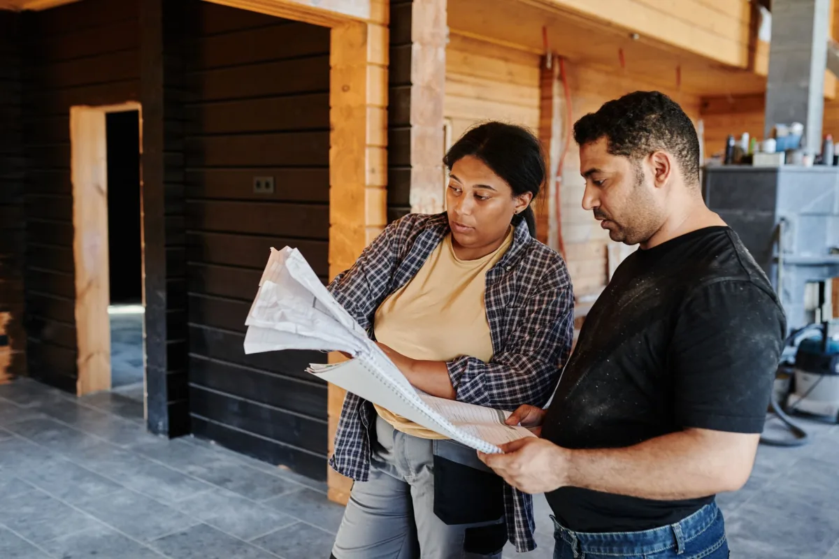 Contractor handing a homeowner an itemized septic repair estimate