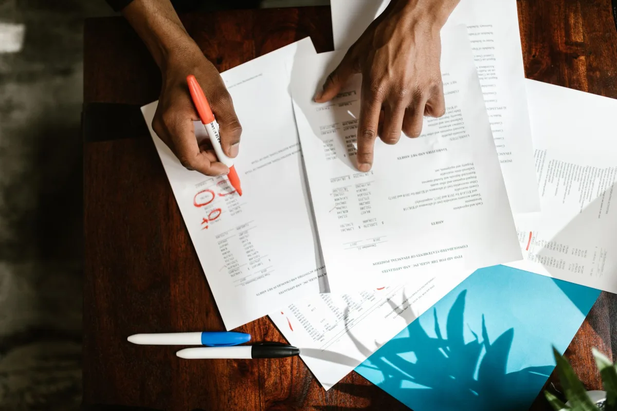 Homeowner reviewing a written septic inspection report at a table