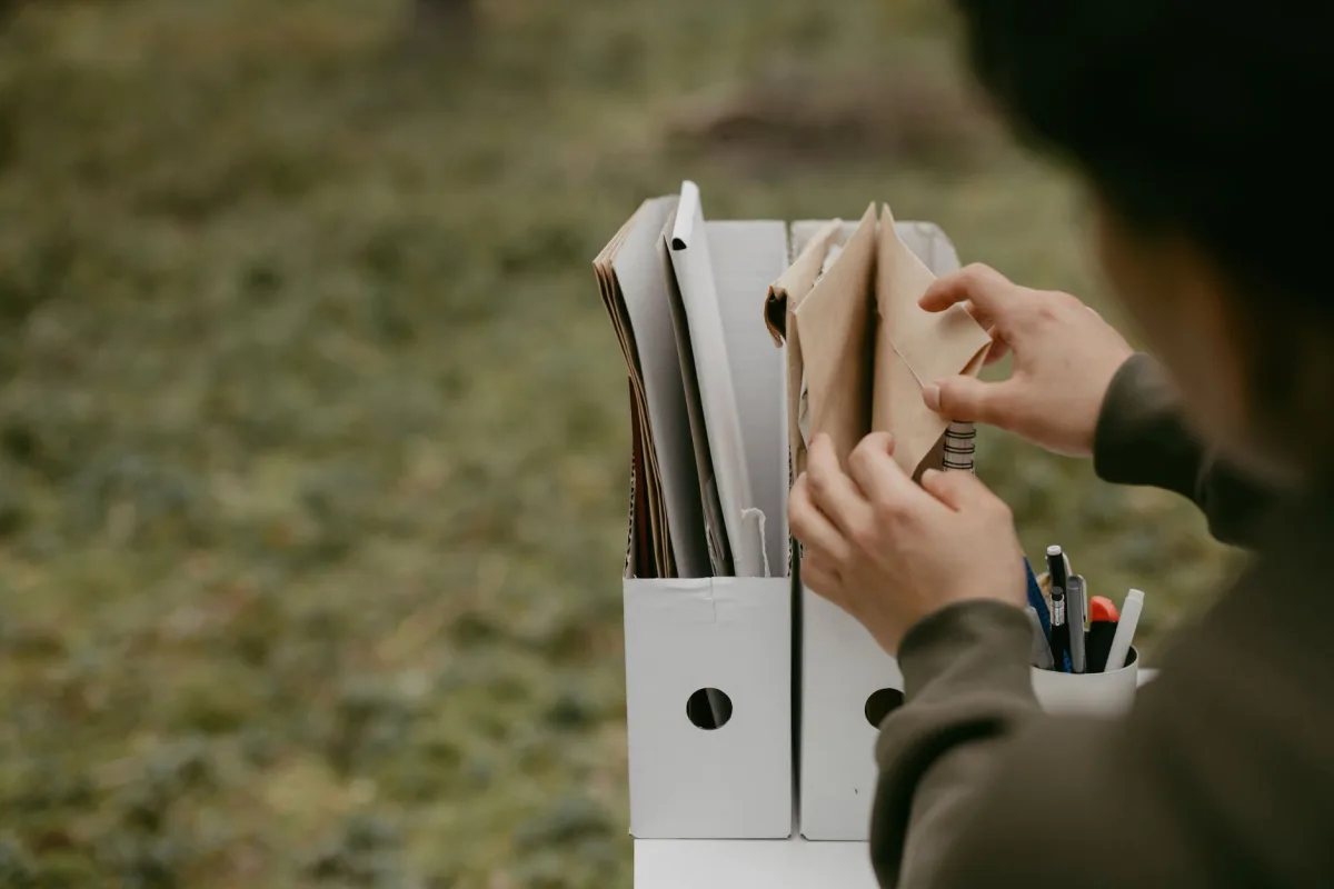 Folder of home documents and receipts organized for septic records