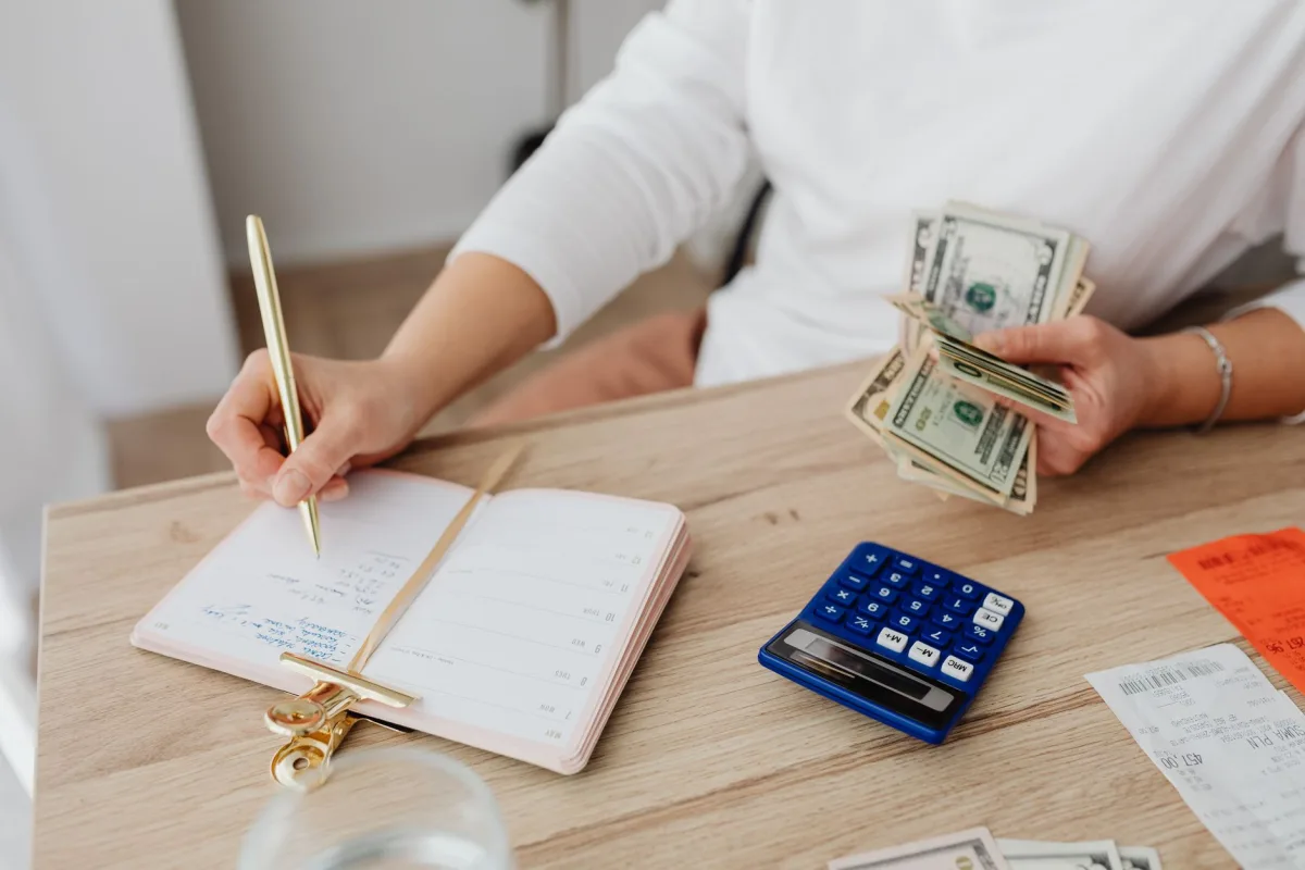 Homeowner reviewing costs and setting aside money for maintenance