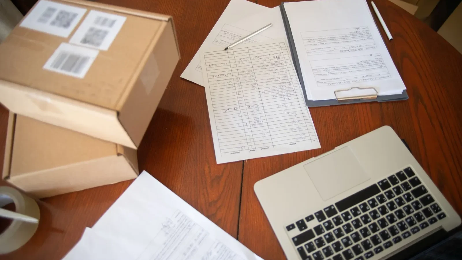Homeowner reviewing a written septic repair estimate at a kitchen table