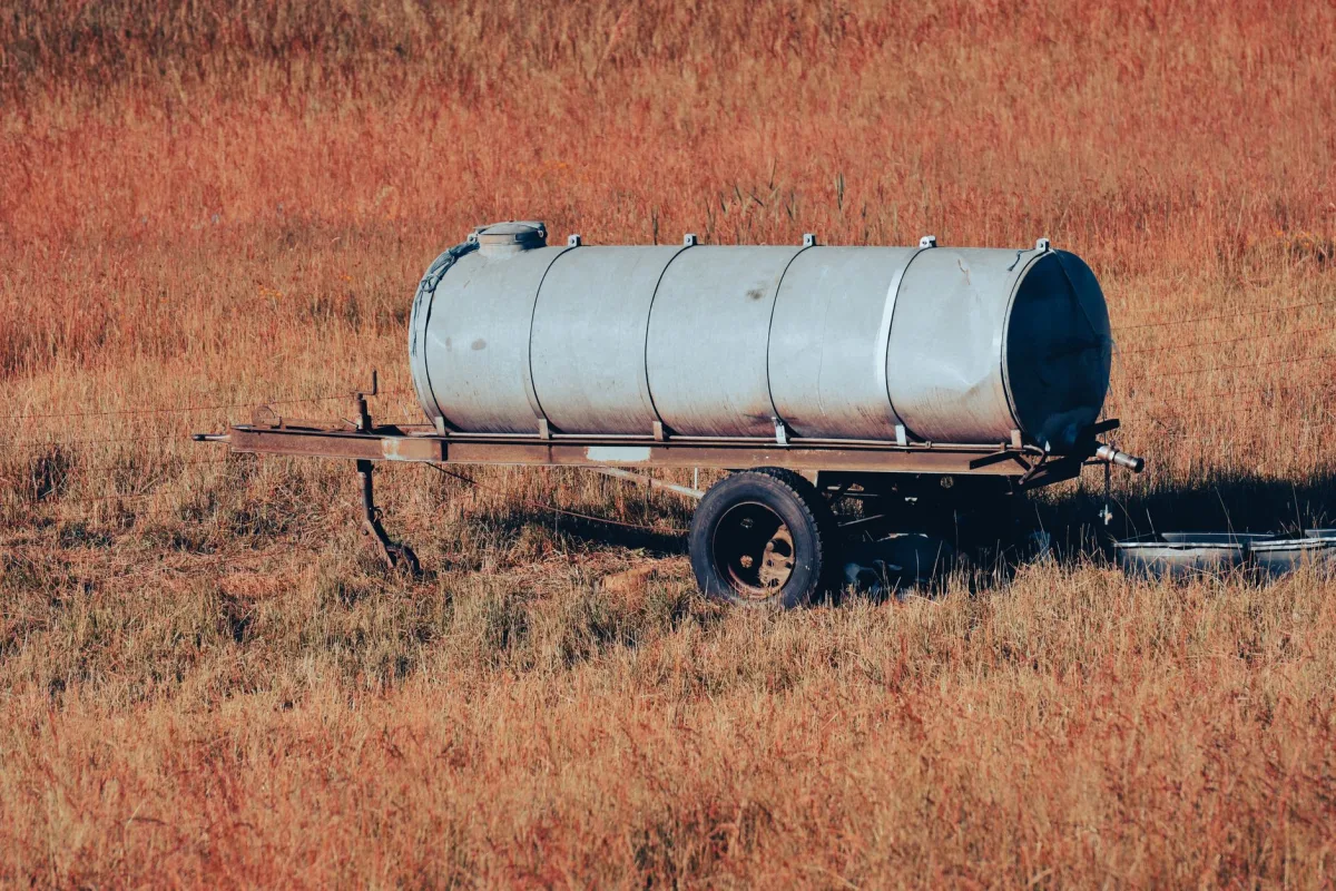 Crew installing a septic tank following local state and county code requirements