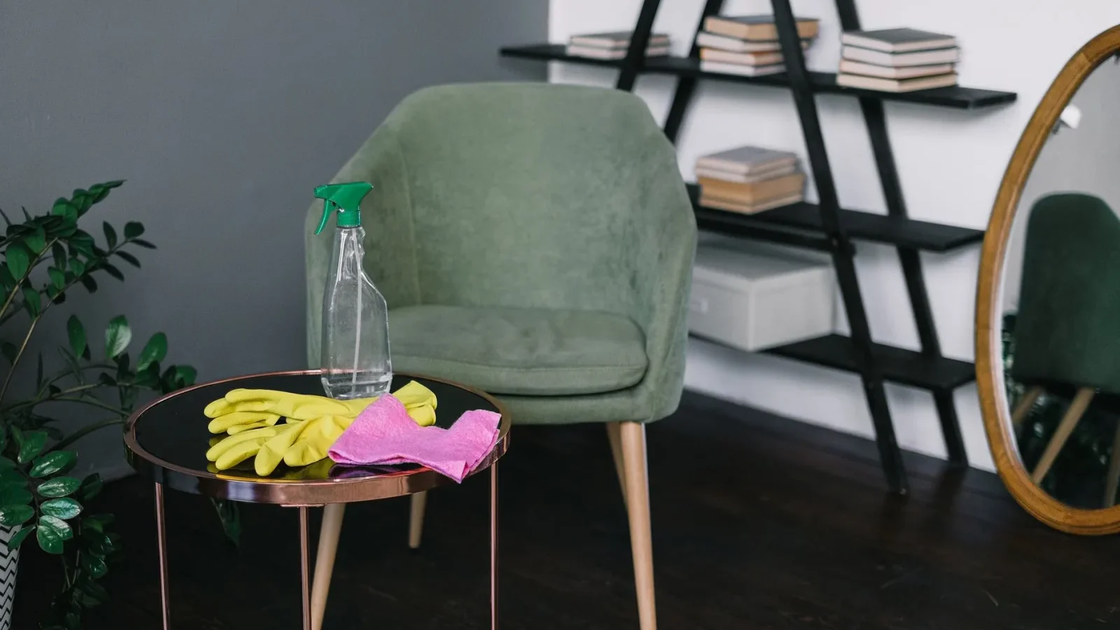 Vinegar, baking soda, and plant-based spray bottles arranged as septic-safe cleaning supplies